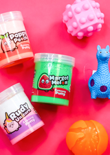 A pink background with three brightly coloured jars of sensory putty and three fidget toys