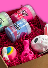 a box with three bright coloured jars of sensory putty and three squidgy fidget toys