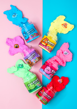 6 jars of different coloured cloud putty which is coming out the jars with the charms on the putty. On a blue and pink background