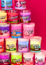 a tower of different coloured jars of cloud and sensory putty on a pink background