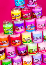 a tower of different coloured jars of cloud and sensory putty on a pink background