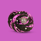 A swirl of purple and black sensory putty decorated with black clay sprinkles, white clay stars, black bingsu beads and a cartoon bat charm inthe centre, on a purple background