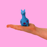 a blue orbs filled llama fidget toy in the palm of a hand, against a pink background