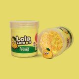 a jar of yellow sensory putty with Lola lemon on with a laid down jar next to it showing yellow floam beads, clay sprinkles and a lemon charm