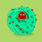 A bright green swirled sensory putty decorated with green bingsu beads and red clay sprinkles. Small watermelon clay sprinkles are dotted about. A smiling watermelon charm is in the middle