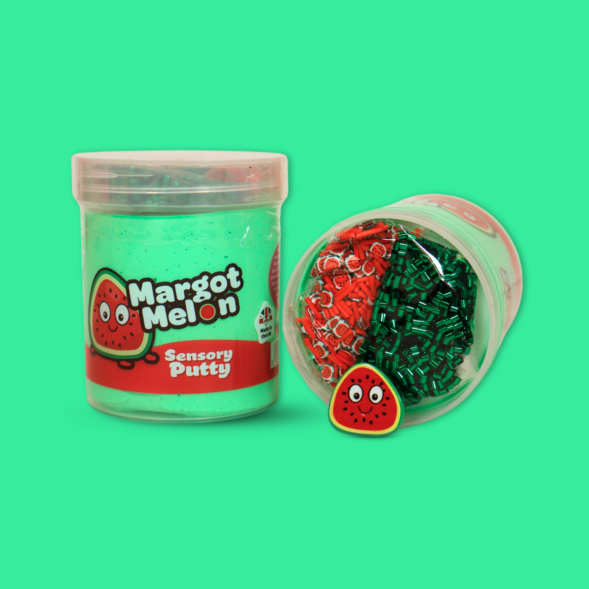 A jar of green sensory putty named Margot Melon, with a laid down jar next to it showing green bingsu beads, red clay sprinkles and a watermelon charm