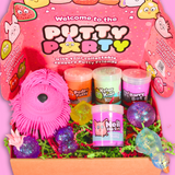 bright pink box with colourful shred, contains 4 jars of cololurful sensory putty and an array of sugar fidget balls in different shapes and a large shaggy squish dog.