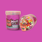 A jar of purple sensory putty called Neil the Cat. A jar laid next to it showing multicoloured floam balls, clay sprinkles and a sphynx cat charm.