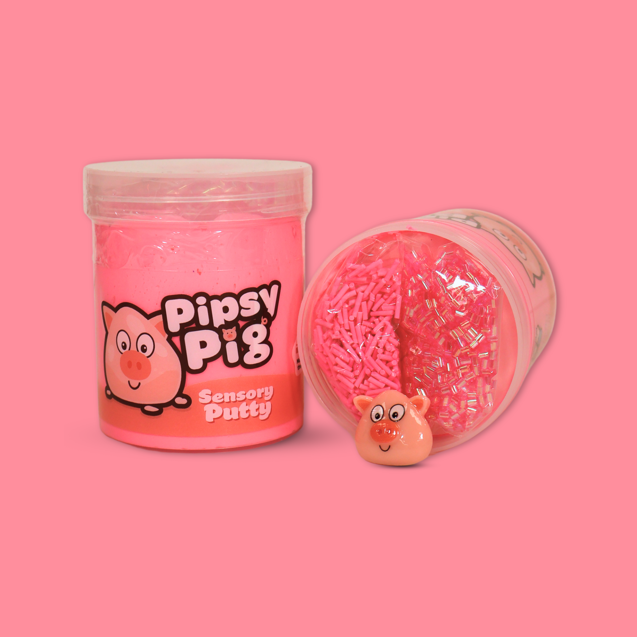 A jar of pink sensory putty called Pipsy Pig, a jar laid on its side next to it showing pink bingsu beads, clay sprinkles and a pig charm