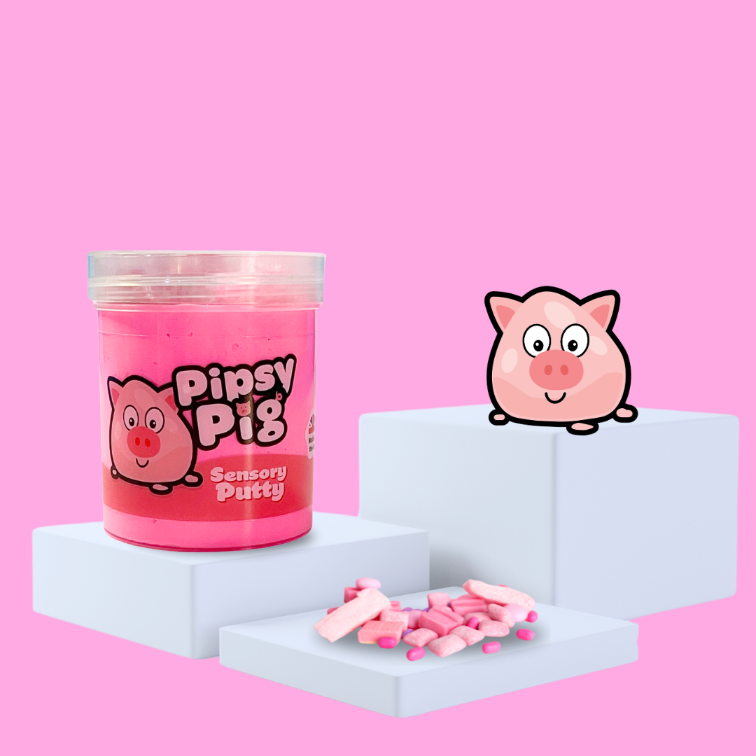 Pink sensory putty on a plinth, collectable charm Pipsy Pig to the side, with some bubblegum showcasing the scent