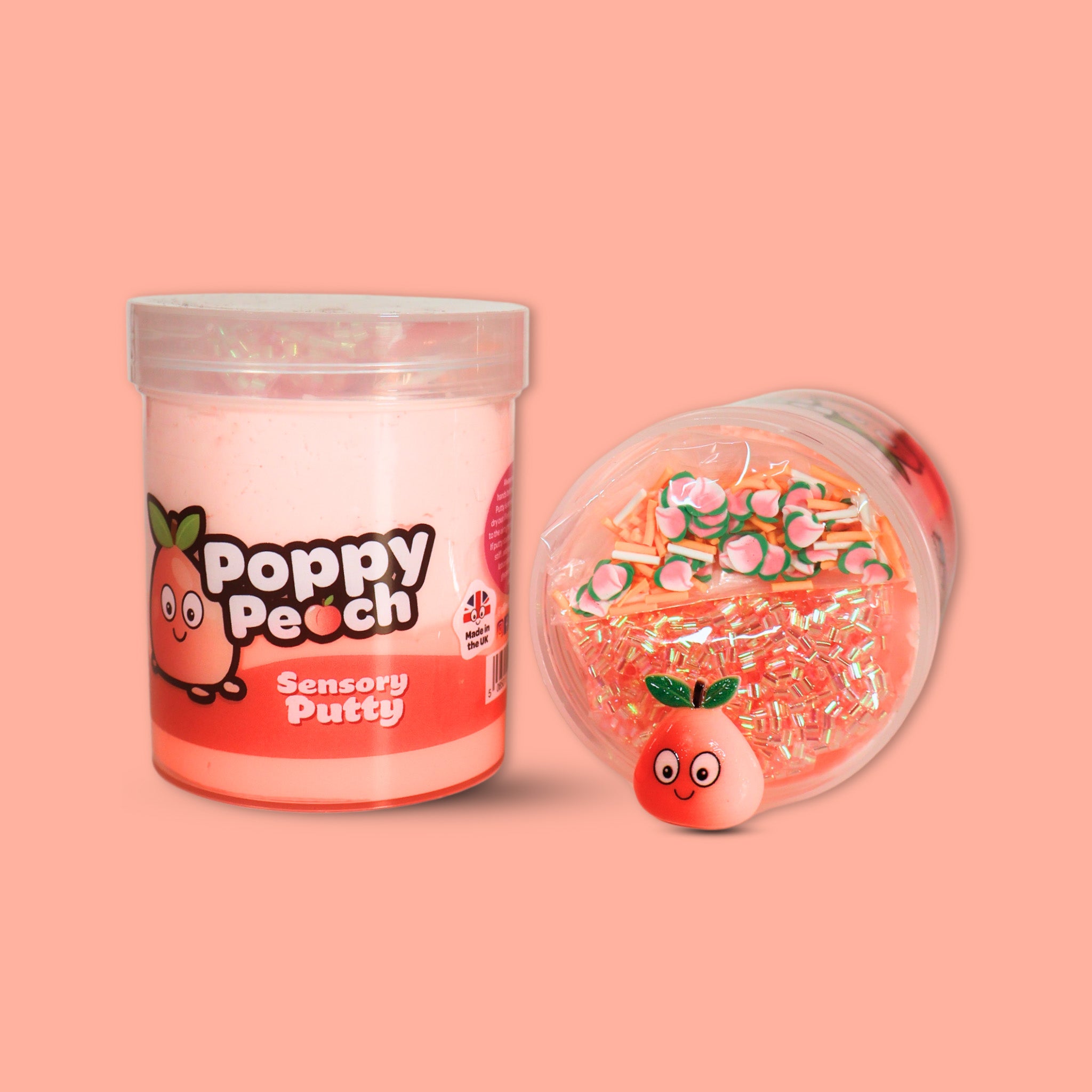 A jar of duo peach coloured sensory putty called Poppy Peach, a jar laid on its side next to it showing peach bingsu beads, clay sprinkles and a peach charm