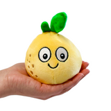 White background with a hand coming in from the side holding a lemon shaped sugar ball with a smiley cartoon face