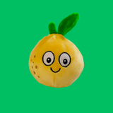 Green background with a lemon sugarball with a cartoon smiley face